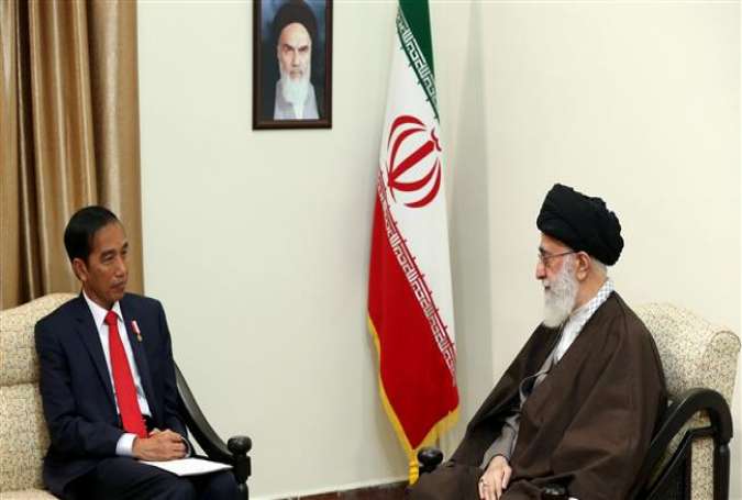 Leader of the Islamic Revolution Ayatollah Seyyed Ali Khamenei (R) receives Indonesian President Joko Widodo in Tehran on December 14, 2016.