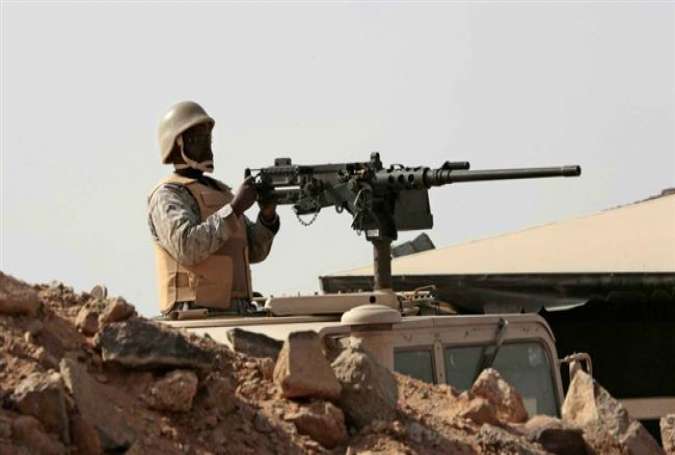 In this file photo, a Saudi soldier sits atop an armored vehicle on the border with Yemen, at a military post in Najran, Saudi Arabia.