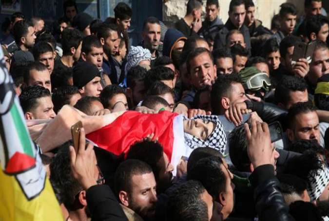 Palestinians attend the funeral of 17-year old Qusay al-Amour, who was killed by Israeli forces, January 17, 2017.