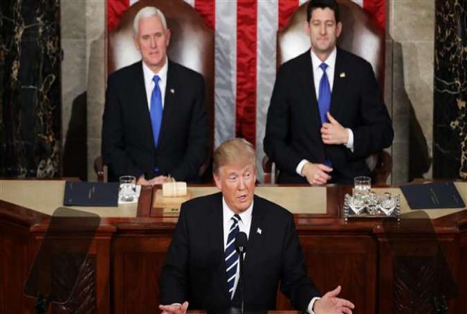 US President Donald Trump addresses a joint session of the US Congress as Vice President Mike Pence (L) and House Speaker Representative Paul Ryan (R) look on on February 28, 2017, in the House chamber of the US Capitol in Washington, DC.