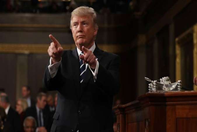 US President Donald Trump points to the audience after addressing a joint session of Congress in Washington, DC, on February 28, 2017.