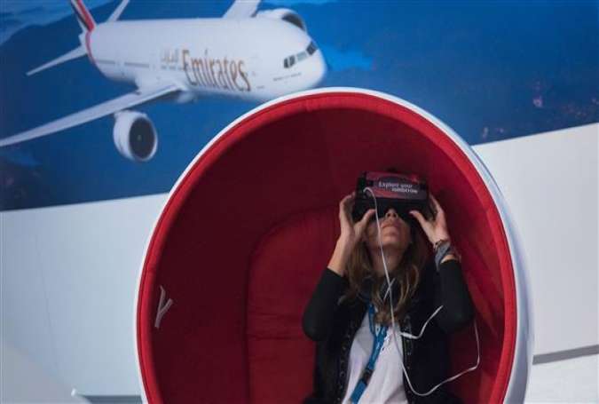 A visitor uses virtual reality (VR) glasses at the stand of Emirates Airline at the International Tourism Trade Fair (ITB) on March 8, 2017.