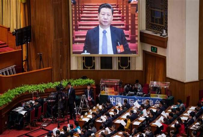 Chinese President Xi Jinping appears on a screen during the second plenary session of the National People’s Congress at the Great Hall of the People in Beijing on March 8, 2017.