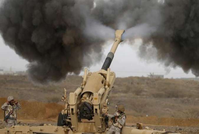 A Saudi artillery unit fires shells towards Houthi positions from the Saudi border with Yemen.