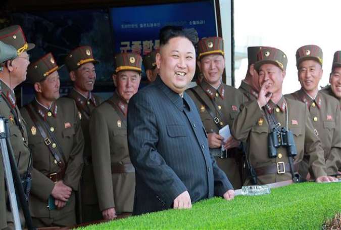 North Korean leader Kim Jong-un stands in front of a group of his generals. (Photo by AFP)