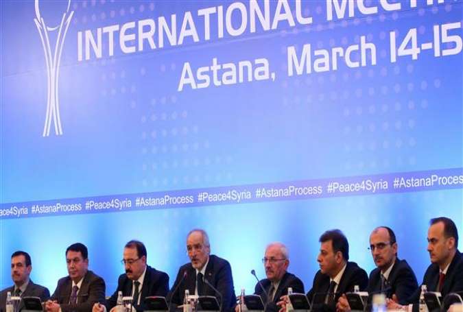Syrian UN ambassador and head of the government delegation Bashar al-Ja’afari (4th L), Syrian Ambassador to Russia Riad Haddad (3rd L) and other delegates attend the third round of Syria talks at the Rixos President Hotel in the Kazakh capital of Astana on March 15, 2017. (Photo by AFP)