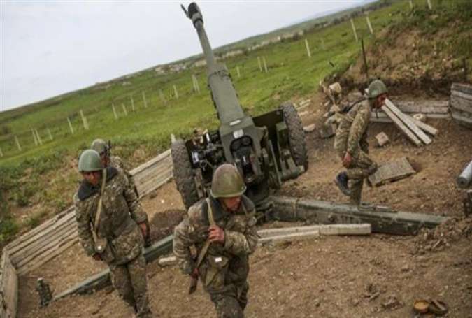 The undated photo shows Armenian separatists preparing to fire artillery in Karabakh.