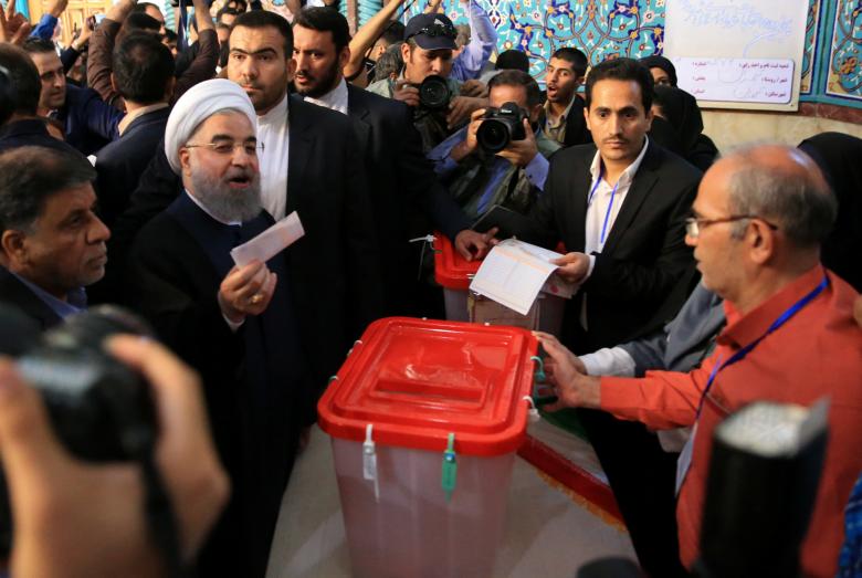 Iranian President Hassan Rouhani casts his vote during the presidential election in Tehran, Iran, May 19, 2017.
