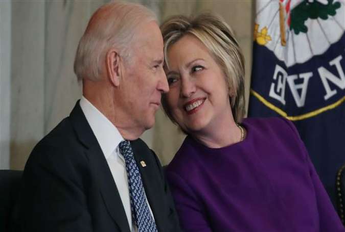 Former US Secretary of State, Hillary Clinton shares a laugh with US Vice President Joseph Biden, during a ceremony on Capitol Hill December 8, 2016 in Washington, DC. (Photos by AFP)
