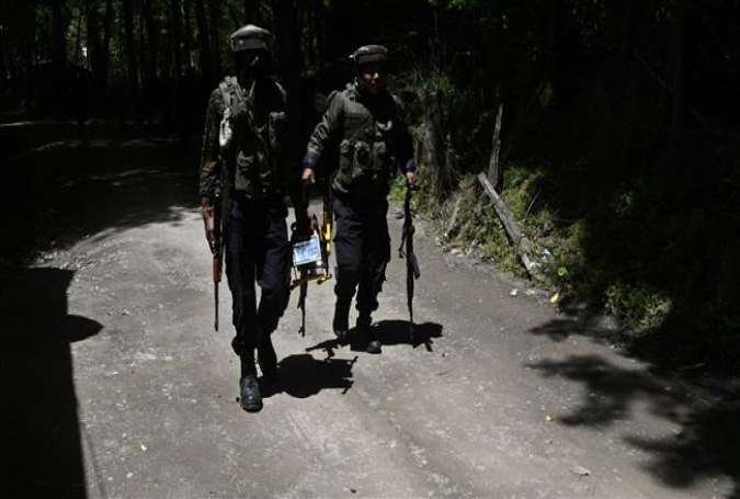 Indian army soldiers patrol after two Kashmiri militants were killed during a gunfight, in the Tral area, south of Srinagar, Kashmir, May 27, 2017. (Photo by AFP)