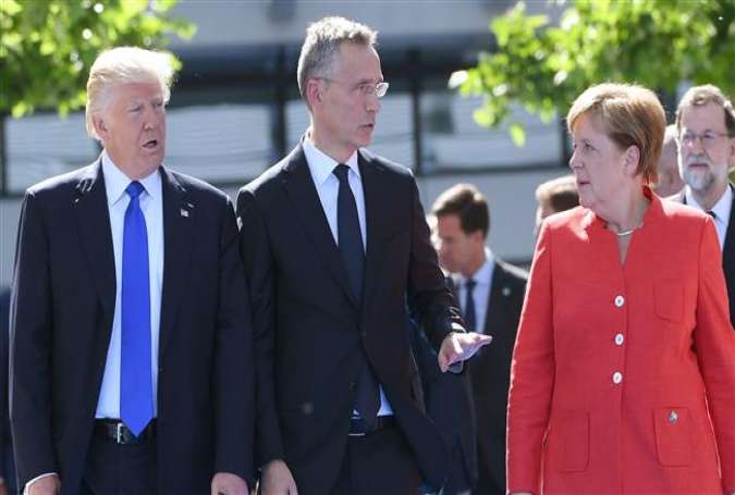 NATO Secretary General Jens Stoltenberg (C) escorts US President Donald Trump (L) and German Chancellor Angela Merkel before the unveiling ceremony of the Berlin Wall monument at the NATO headquarters in Brussels, May 25, 2017. (Photo by AFP)