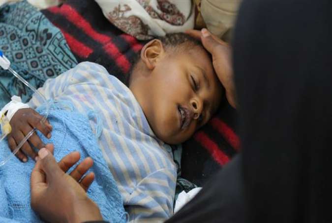 A child with cholera receives treatment at the Sab
