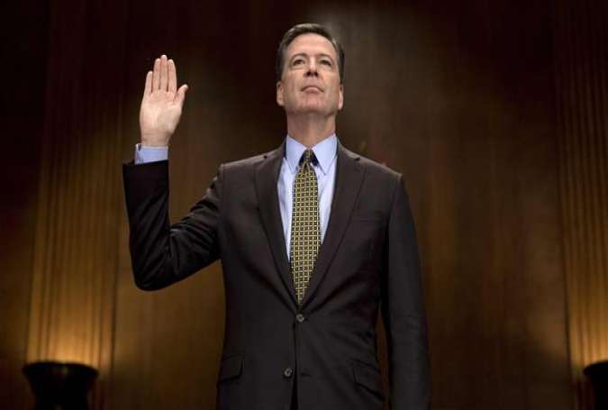 This file photo taken on May 03, 2017 shows then FBI Director James Comey being sworn in prior to testifying before the Senate Judiciary Committee on Capitol Hill in Washington, DC. (Photo by AFP)