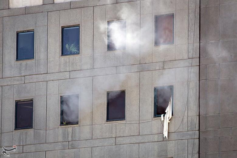 Smoke is seen during an attack on the Iranian parliament in central Tehran, Iran.