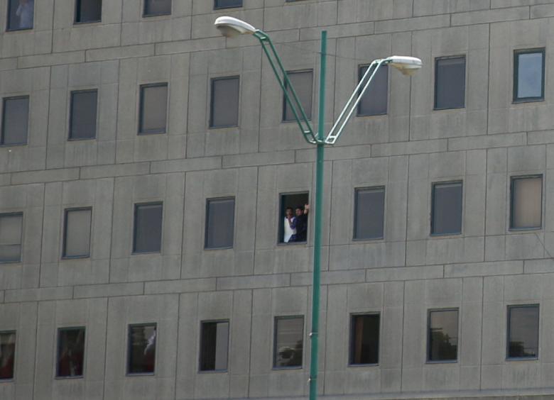 Security forces look out of a window of the parliament's building during a gunmen attack in central Tehran, Iran.