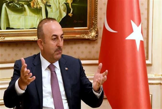 Turkish Foreign Minister Mevlut Cavusoglu attends a press conference in Kuwait City on June 15, 2017 as part of his tour of Persian Gulf Arab countries. (Photos by AFP)