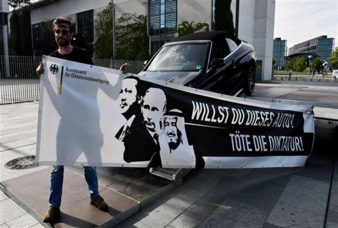 Activists against the up-coming G20 summit present a Mercedes car with a banner featuring (L-R) Turkish President Recep Tayyip Erdogan, Russian President Vladimir Putin and Saudi King Salman bin Abdulaziz reading "Do you want this car? Kill dictatorship" in front of the Chancellery in Berlin on July 3, 2017. (Photos by AFP)