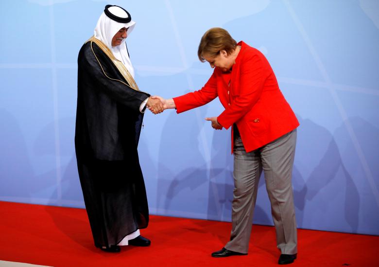 German Chancellor Angela Merkel welcomes Saudi Arabia's Minister of State Ibrahim Abdulaziz Al-Assaf.