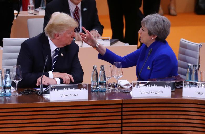 Britain's Prime Minister Theresa May talks with U.S. President Donald Trump during the working session.