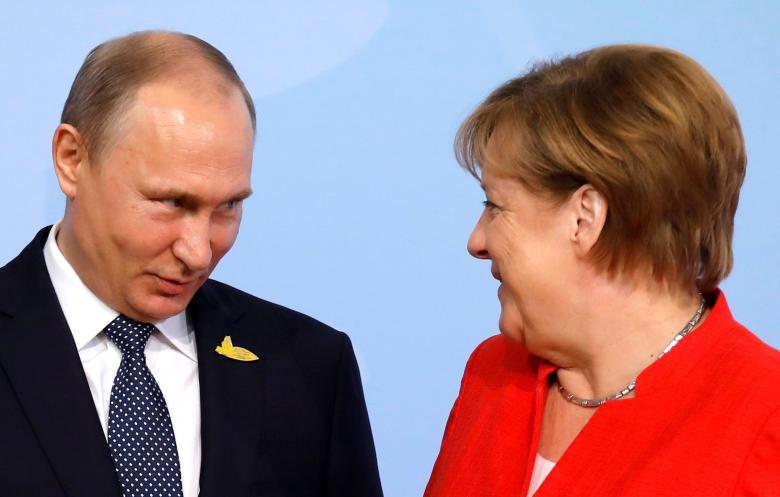 German Chancellor Angela Merkel welcomes Russia's President Vladimir Putin.