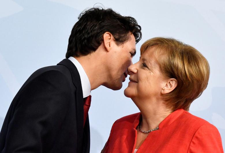 German Chancellor Angela Merkel greets Canada's Prime Minister Justin Trudeau.