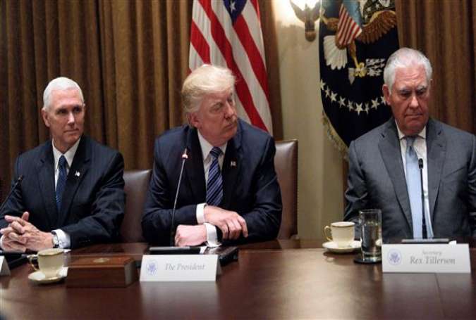 This file photo shows US President Donald Trump(C), Vice President Mike Pence (L), and Secretary of State Rex Tillerson at the White House in Washington, DC, on June 30, 2017. (By AFP)