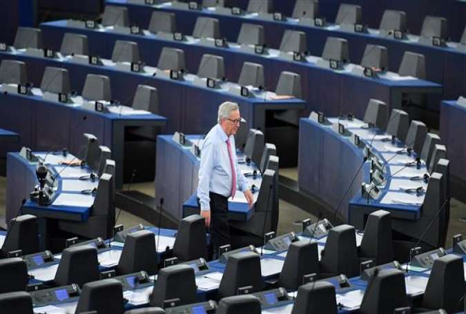 This file photo taken on May 17, 2017 shows EU Commission president Jean-Claude Juncker walking through the Chamber before a debate on the conclusions of the last European Council, at the European Parliament in Strasbourg, eastern France. (Photo by AFP)