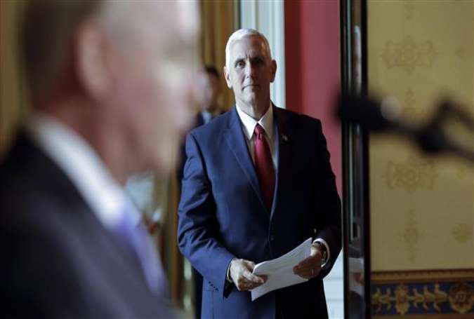 US Vice President Mike Pence waits before arrival of President Donald Trump at the White House in Washington, DC on July 24, 2017. (Photo by AFP)