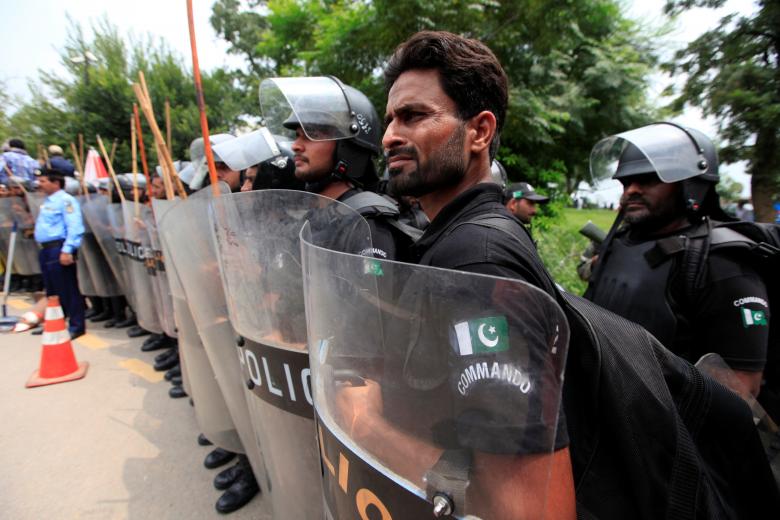 Members of the police elite force stand guard outside the Supreme Court in Islamabad.