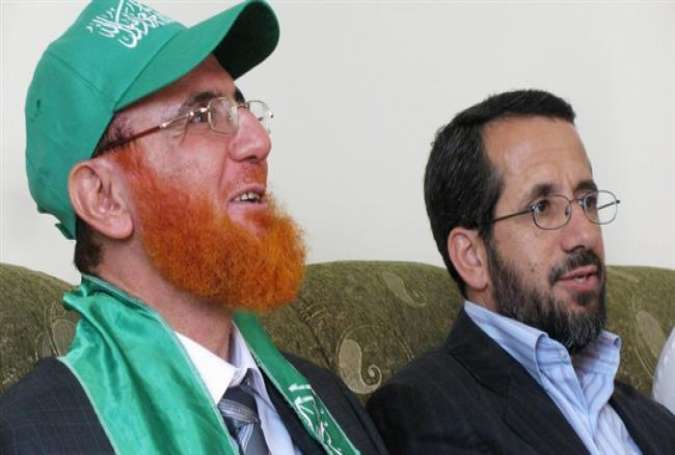 Palestinian Hamas-affiliated lawmaker Muhammad Hassan Abu Tir (L)