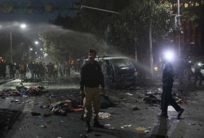 A policeman stands guard at the scene after a blast in Lahore, Pakistan February 13, 2017.