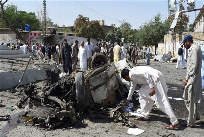 Pakistani security officials inspect the site of a powerful explosion that targeted a police vehicle in Quetta on June 23, 2017. (AFP photo)