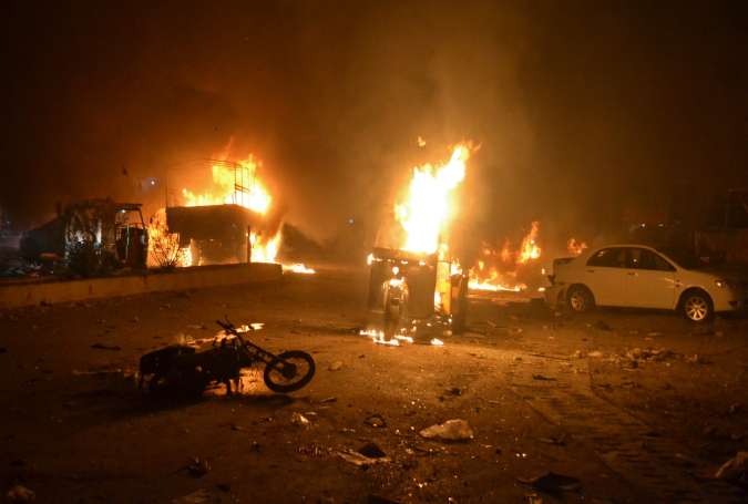 Burning vehicles after bomb blast in Quetta, Pakistan, on Sunday.