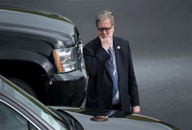 White House Chief Strategist Steve Bannon waits as US President Donald Trump arrives at Lynchburg Regional Airport May 13, 2017 in Lynchburg, Virginia. (Photo by AFP)