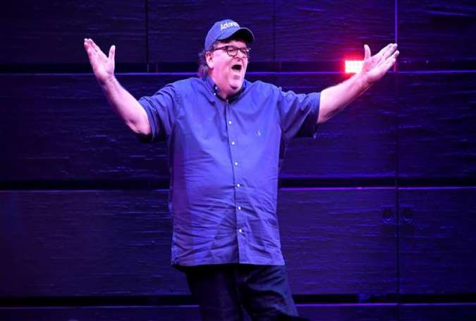 Michael Moore speaks onstage during "The Terms Of My Surrender" Broadway Opening Night at Belasco Theatre on August 10, 2017 in New York City. (Photo by AFP)
