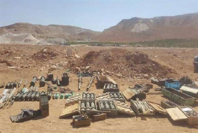 This Photo purportedly shows a discovered weapons cache left behind by Takfiri Jabhat Fateh al-Sham militants in northeastern Lebanon.