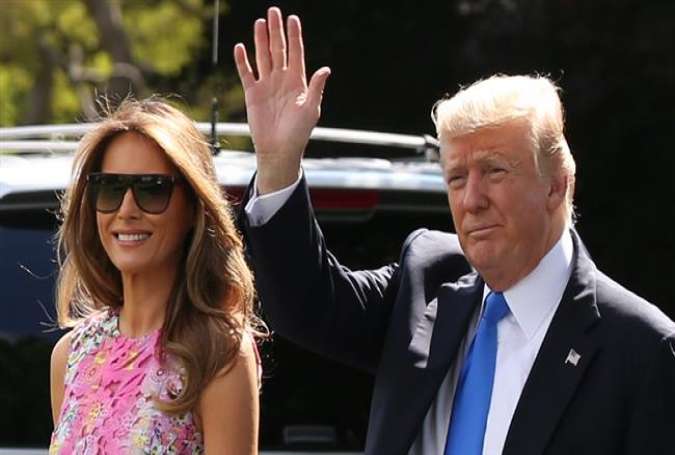 US President Donald Trump and first lady Melania walk the South Lawn of the White House to board the Marine One helicopter July 25, 2017, in Washington, DC. (Photo by AFP)