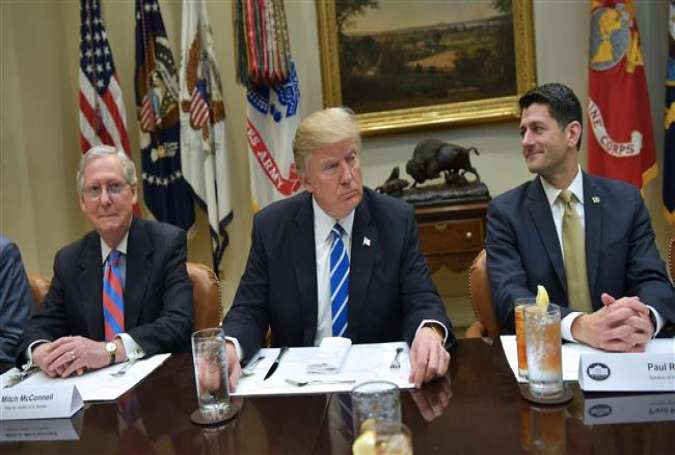 US President Donald Trump is seated for a a lunch with Republican Party House and Senate leadership, including Senate Majority Leader Mitch McConnell (L) and House Speaker Paul Ryan, in the Roosevelt Room of the White House in Washington, DC, March 1, 2017. (Photo by AFP)