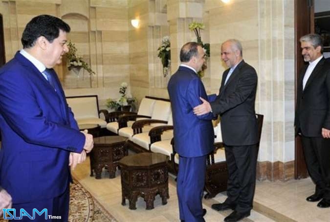 خميس وأوحدي سبل تعزيز العلاقات الاقتصادية بين سورية وإيران