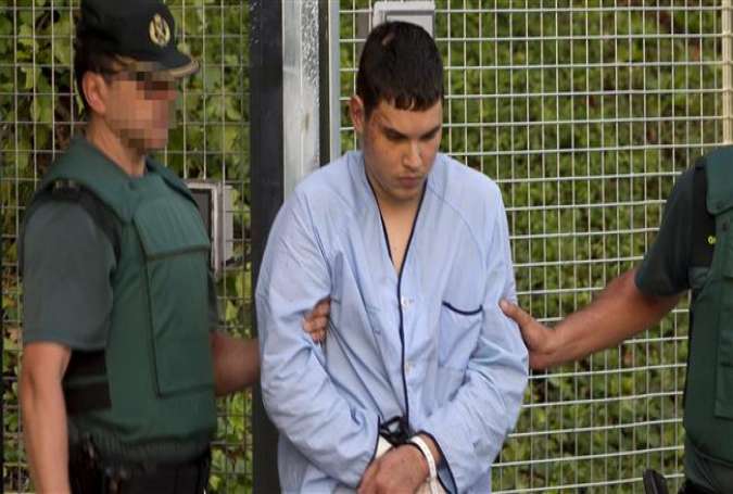 Mohamed Houli Chemlal, suspected of involvement in the recent terror attacks in Spain, is escorted by police from a detention center to a court in Madrid, August 22, 2017. (Photo by AFP)