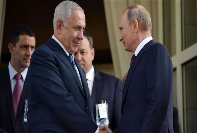 Russian President Vladimir Putin (R) shakes hands with Israeli Prime Minister Benjamin Netanyahu during a meeting at the Bocharov Ruchei state residence in Sochi, Russia, August 23, 2017. (Photo by AFP)