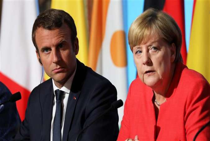 French President Emmanuel Macron (L) and German Chancellor Angela Merkel (Photo by AFP)