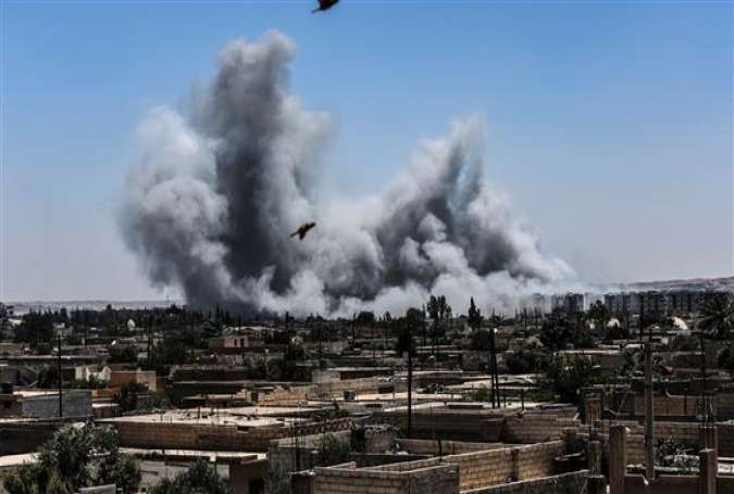 Smoke billows following an airstrike on the western frontline of Raqqah on July 15, 2017, during an offensive by the US-backed Syrian Democratic Forces (SDF). (Photo by AFP)