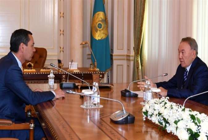 This undated photo shows Kazakh President Nursultan Nazarbayev meeting with Kyrgyz opposition presidential candidate Omurbek Babanov.