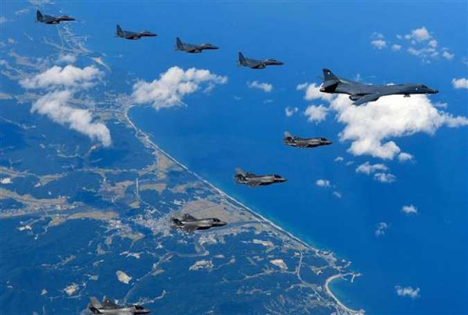 In this handout image provided by South Korean Defense Ministry, US Air Force B-1B Lancer bombers flying with F-35B fighter jets and South Korean Air Force F-15K fighter jets during a training run at the Pilsung Firing Range on September 18, 2017 in Gangwon-do, South Korea.
