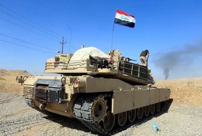 العلم العراقي يرفرف على الحدود العراقية السورية