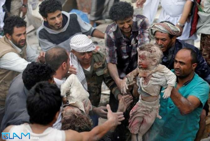 People recover bodies of two children under rubble of a house destroyed by a Saudi-led coalition’s airstrike in Sanaa, Yemen