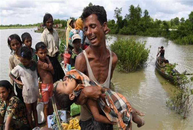 Rohingya refugee is holding his dead son.jpg
