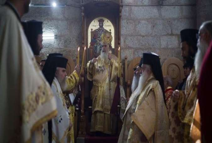 The Greek Orthodox patriarch of the Holy Land, Theophilos III, leads a procession to commemorate the bringing of the remains of the great martyr St. George to Lod, Israel, on November 16, 2017. (Photo by AP)