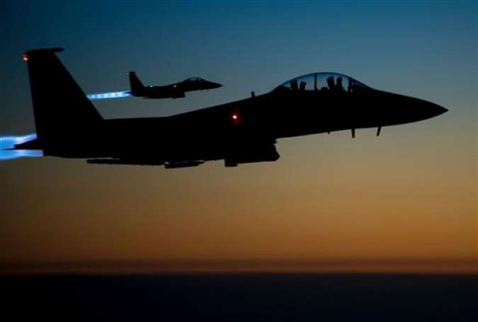 (FILES) This file photo taken by the US Air Forces Central Command and released by the Defense Video & Imagery Distribution System (DVIDS) shows a pair of US Air Force F-15E Strike Eagles flying over northern Iraq early in the morning of September 23, 2014 after conducting airstrikes in Syria. (Photo by AFP)